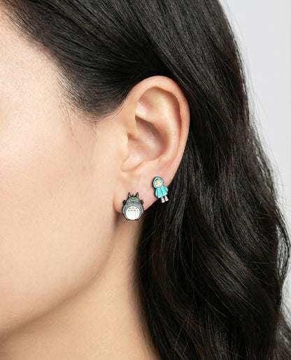 Mismatched My Neighbor Totoro and blue raincoat Mei stud earrings worn on model's ear