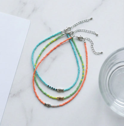  Handmade seed bead fish necklace set in seven vibrant colors including mint turquoise orange blue yellow ivory and black