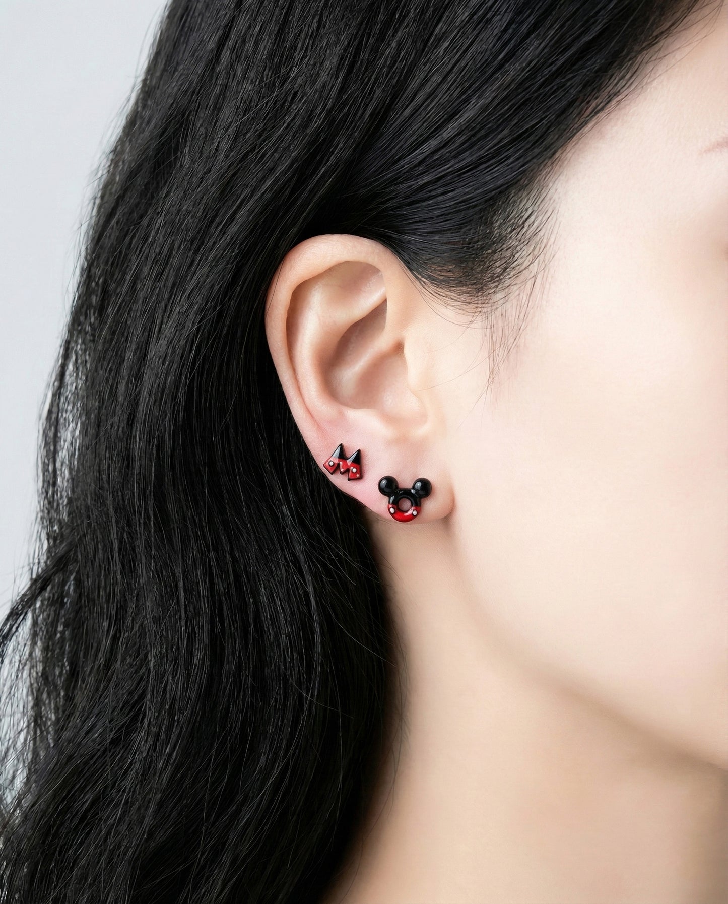 Woman wearing Disney Mickey donut and Minnie ladybug 3D stud earrings with 925 silver posts