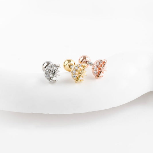 Celestial moon and star titanium cartilage piercings in silver, gold, and rose gold with cubic zirconia pave setting
