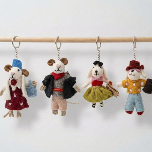 Handmade wool felt animal keychains hanging on wooden rod - mouse and dog couples from Nepal