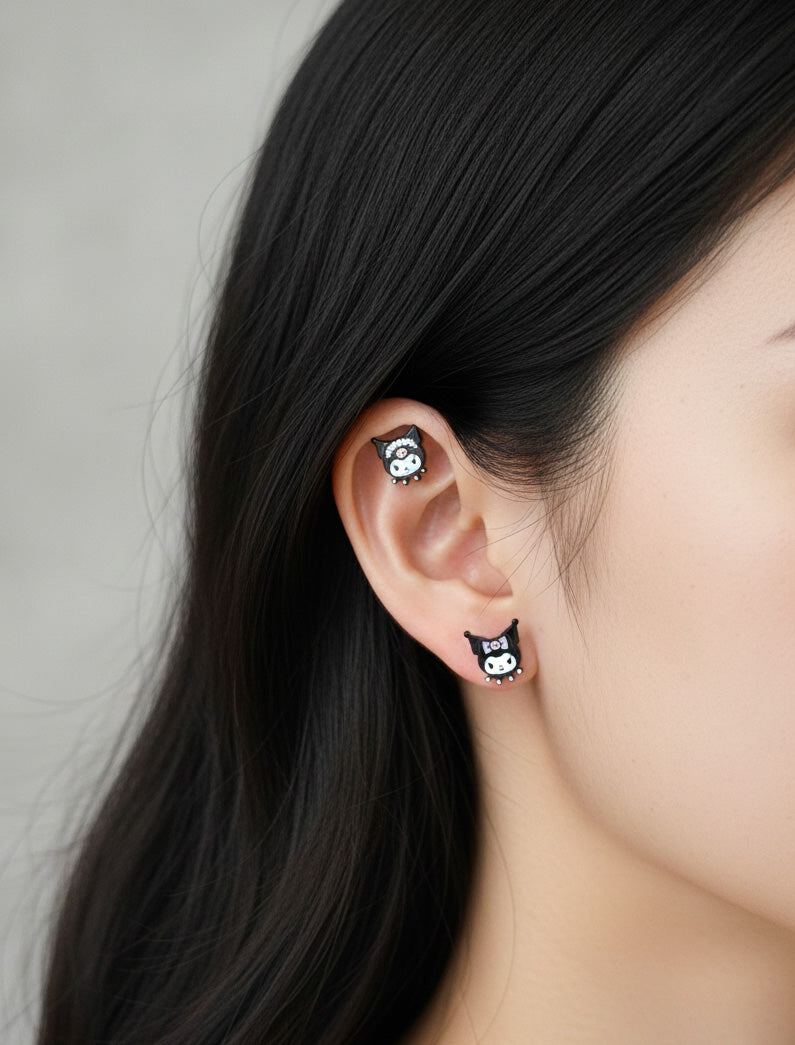 Kuromi surgical steel mini piercing worn on lobe and cartilage showing Ribbon and Double Bows designs, hypoallergenic Sanrio character earrings