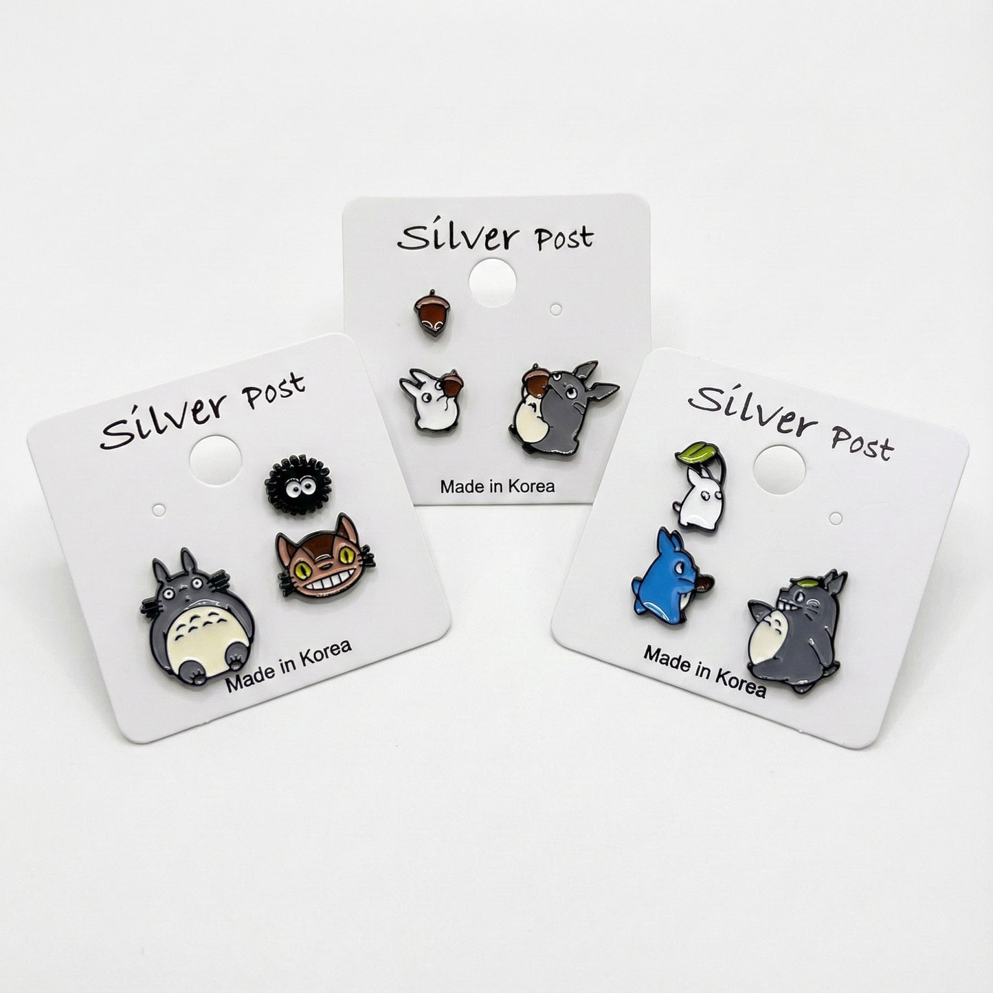 Studio Ghibli character earring set with Totoro Catbus and Soot Sprite on display cards