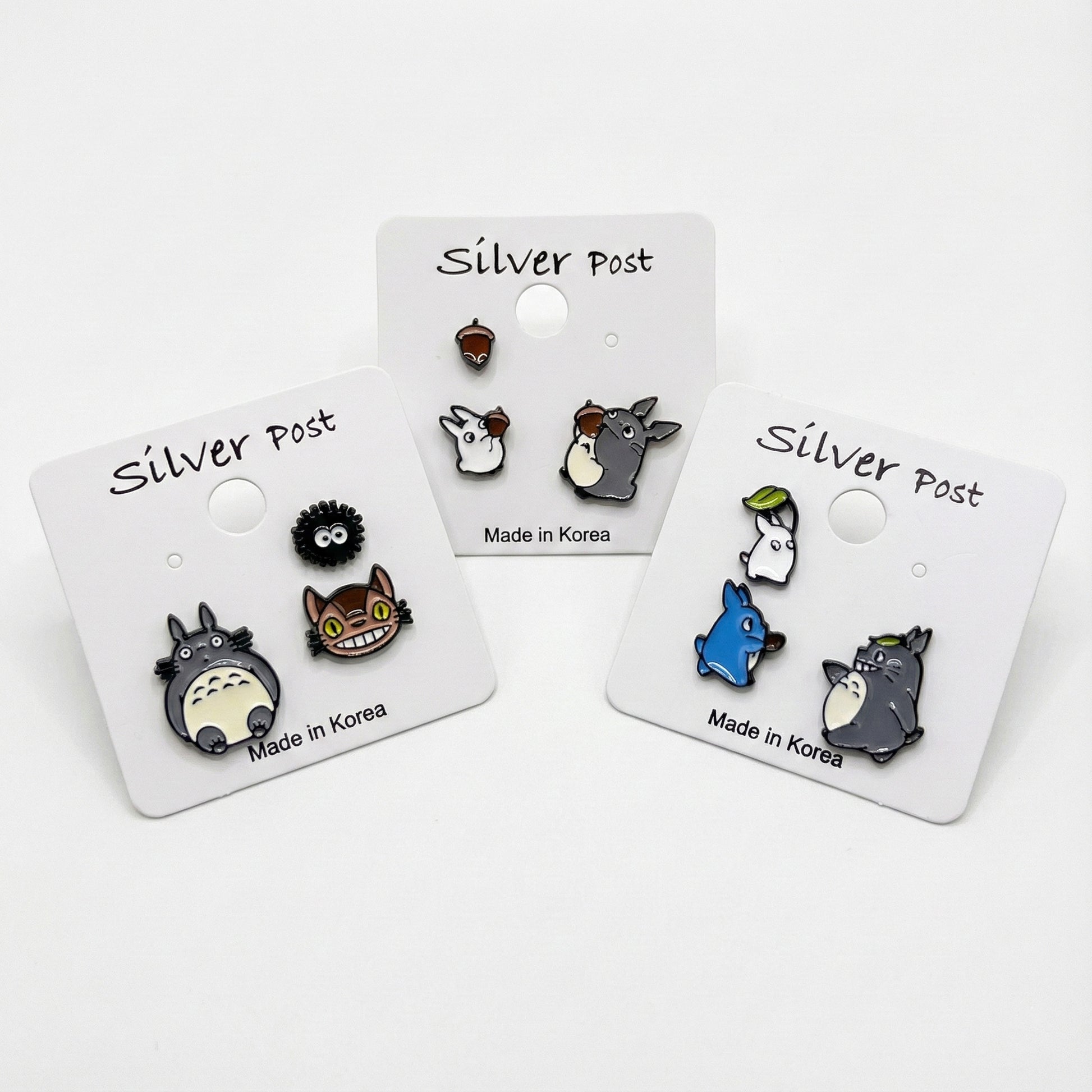 Studio Ghibli character earring set with Totoro Catbus and Soot Sprite on display cards