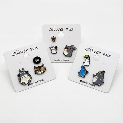 Studio Ghibli character earring set with Totoro Catbus and Soot Sprite on display cards