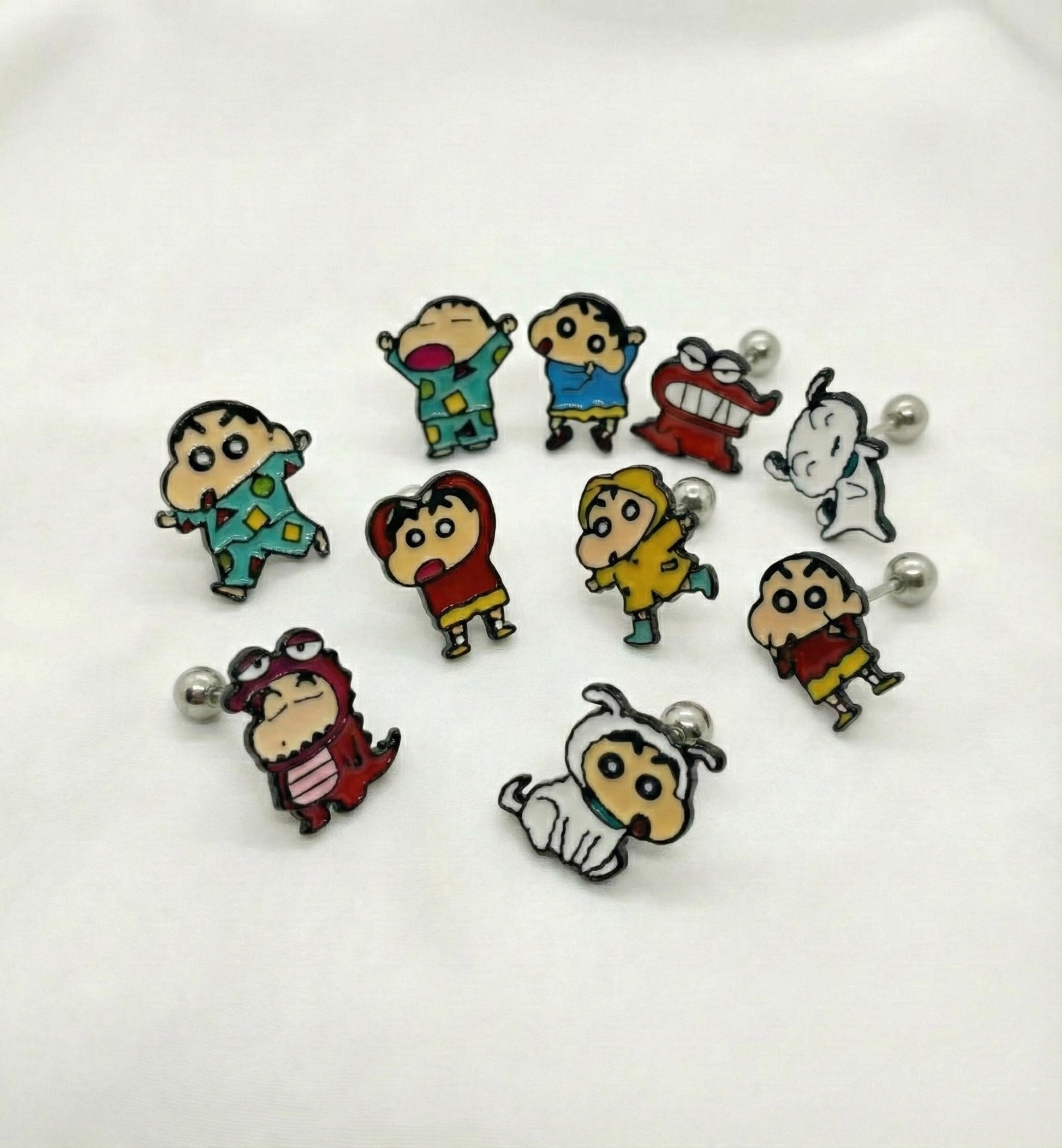 Collection of 12 cute Crayon Shin-chan anime character surgical steel earrings including Shiro dog and Action Mask