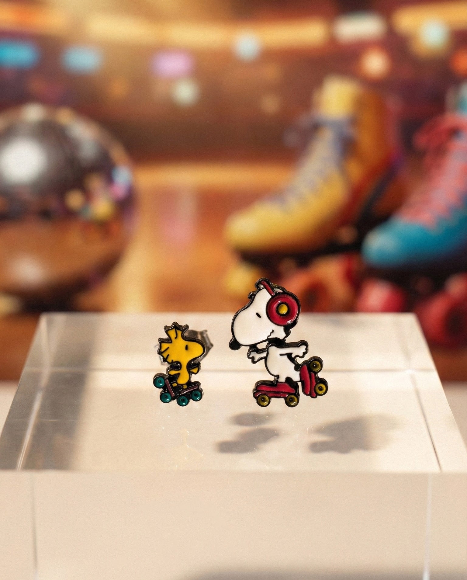 Handmade Snoopy and Woodstock roller skate earring set with headphones displayed on white earring card