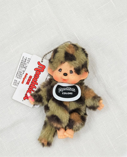 Flat lay product shot — Camo plush doll bag charm keychain 8ttitto8, Y2K streetwear aesthetic for backpack and bag decoration.