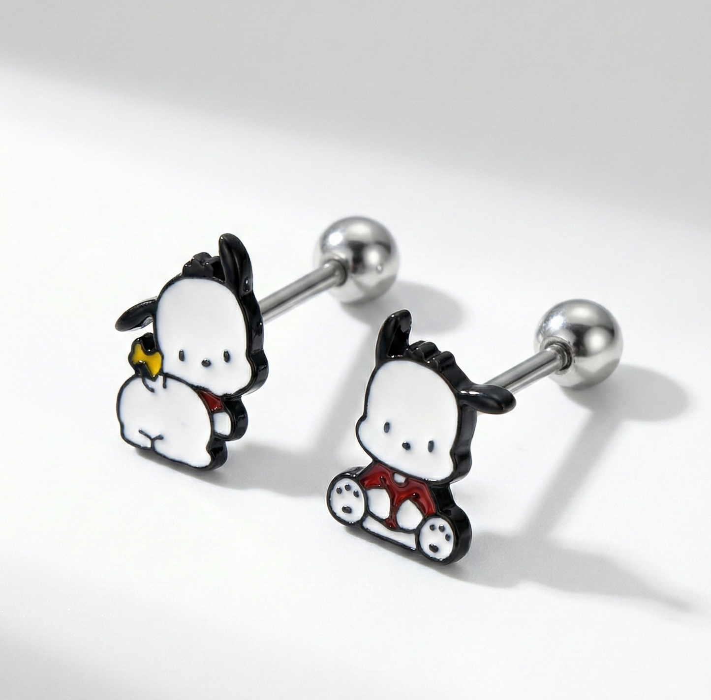 Close-up of Pochacco barbell stud earrings showing surgical steel posts