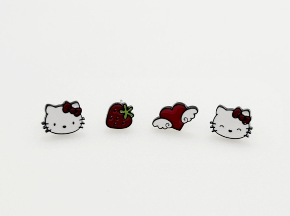 Four Hello Kitty themed enamel stud earrings on white background, featuring cat face strawberry and winged heart designs with red accents, cute Sanrio earring set, 925 silver posts, made in Korea