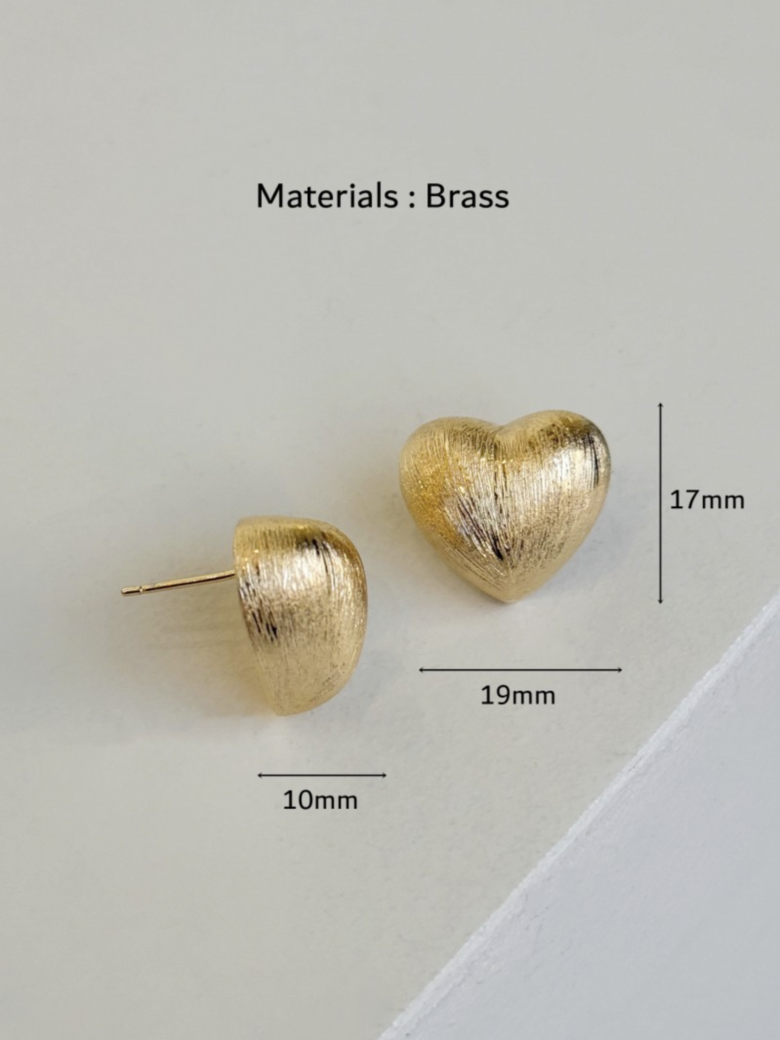 gold brushed-metal heart studs with size markings, showing 19mm width and 17mm height against a clean background.