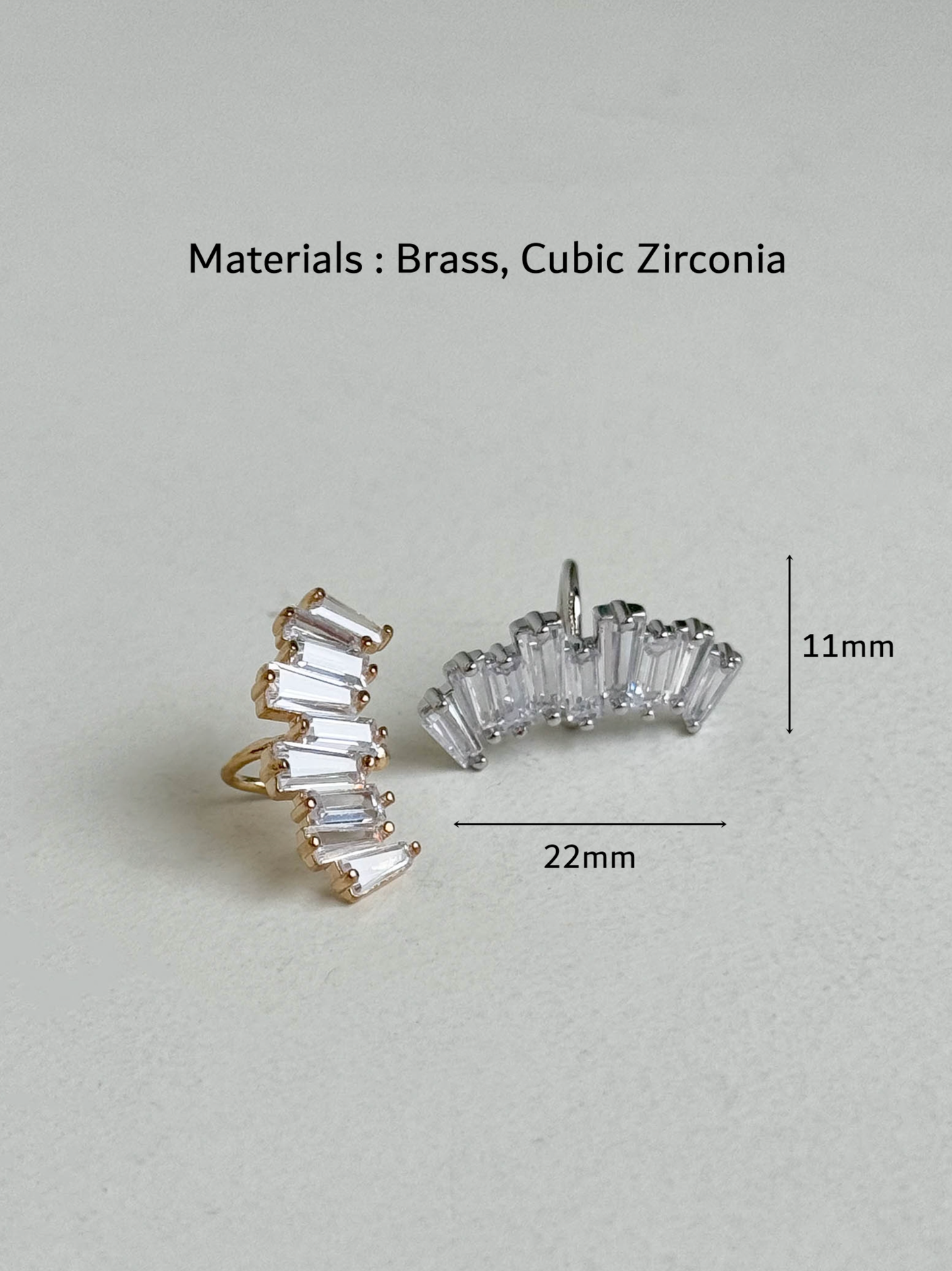 Gold and silver baguette-cut cubic zirconia ear cuffs with measurements shown as 22mm width and 11mm height, brass material, handmade in Korea
