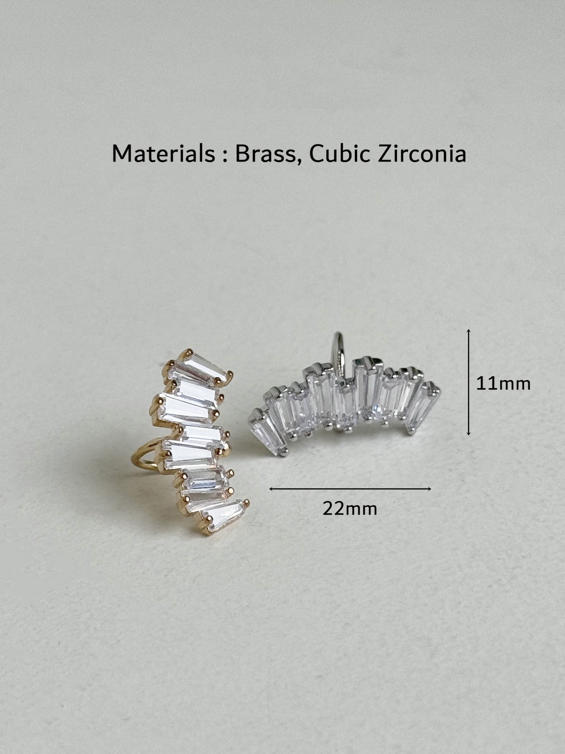Gold and silver baguette-cut cubic zirconia ear cuffs with measurements shown as 22mm width and 11mm height, brass material, handmade in Korea