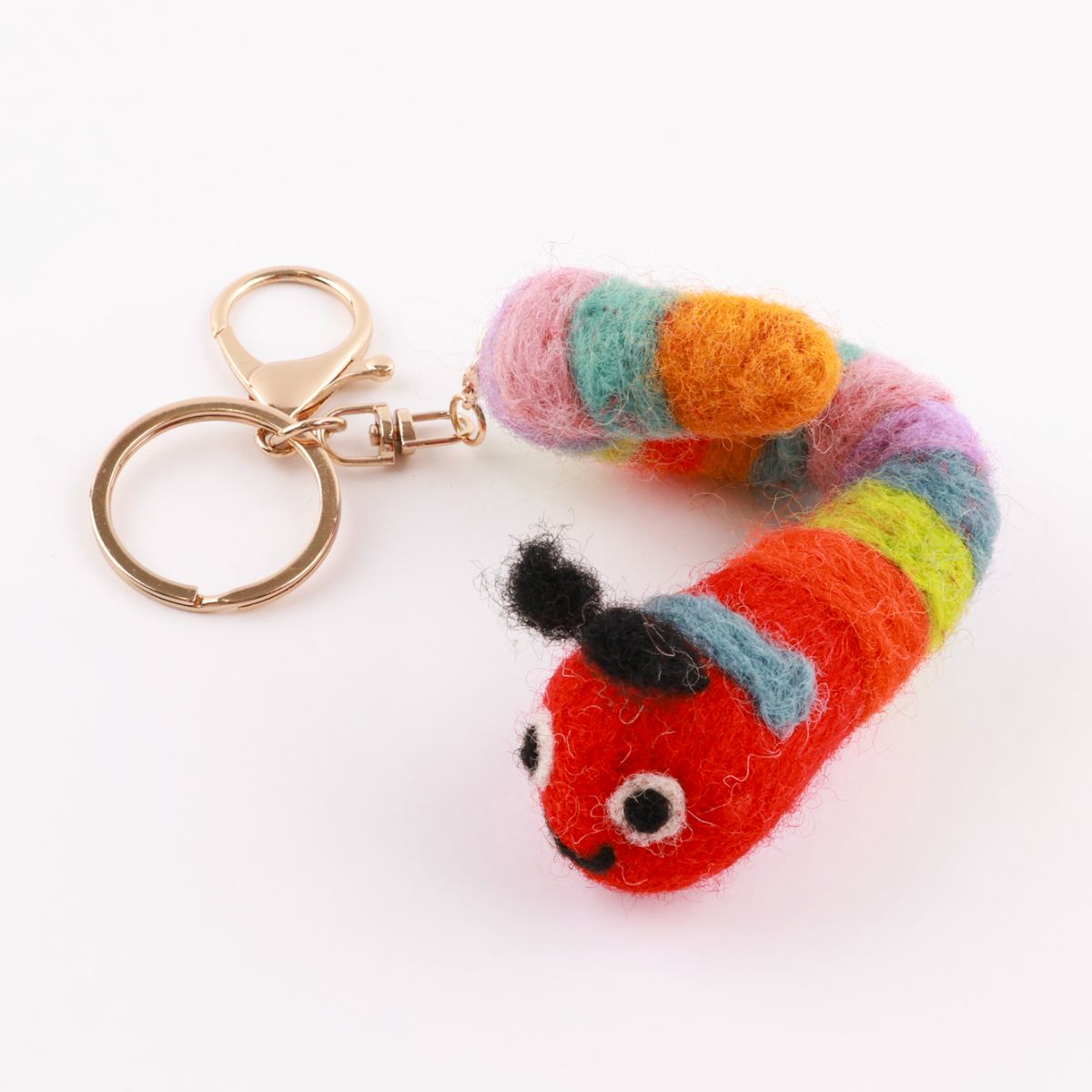 Rainbow caterpillar wool felt keychain showing vibrant multicolor segments handmade
