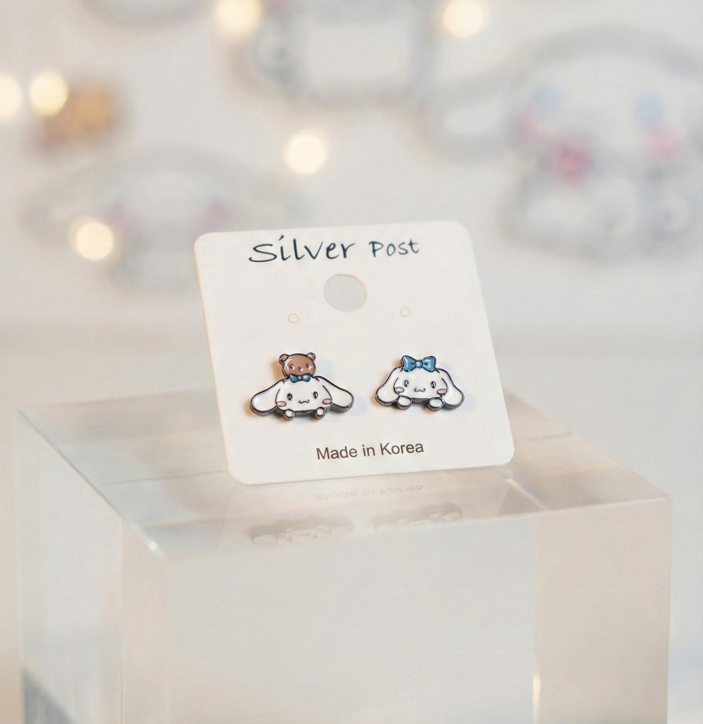 Close up of puppy and bear earrings on display card showing Made in Korea label