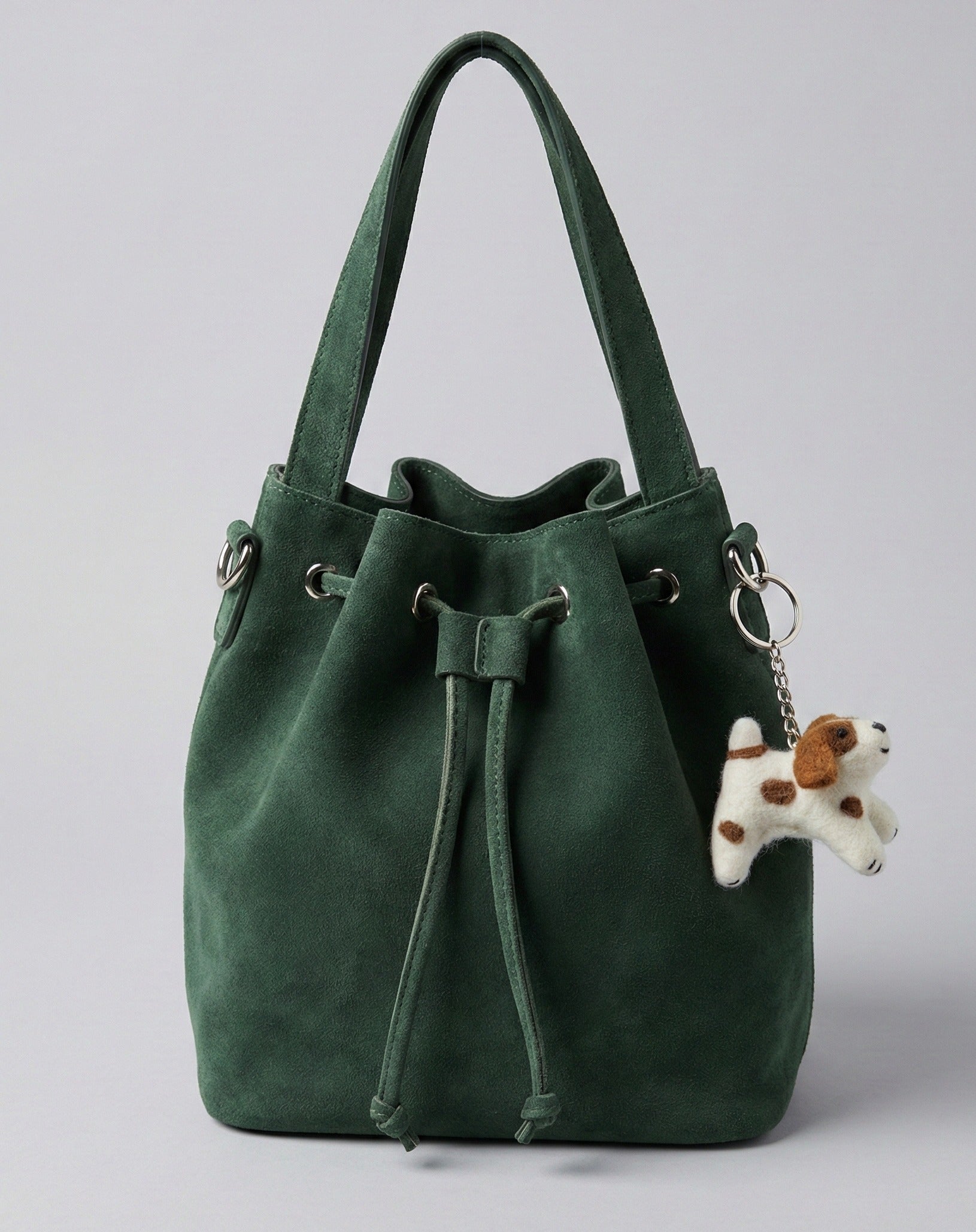  Felt puppy charm on moss green suede drawstring bucket bag
