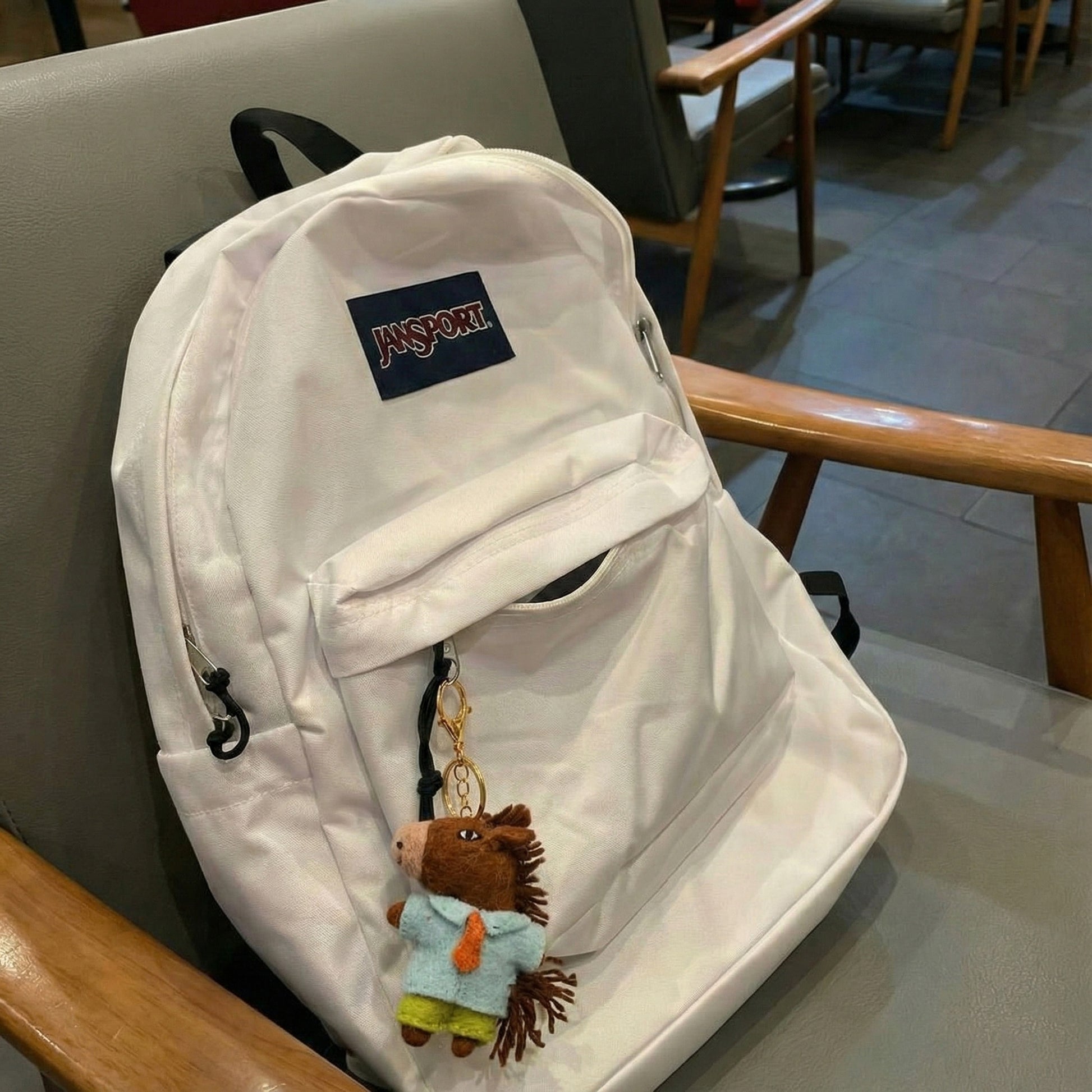 Equestrian gift horse keychain on white backpack for horse lovers