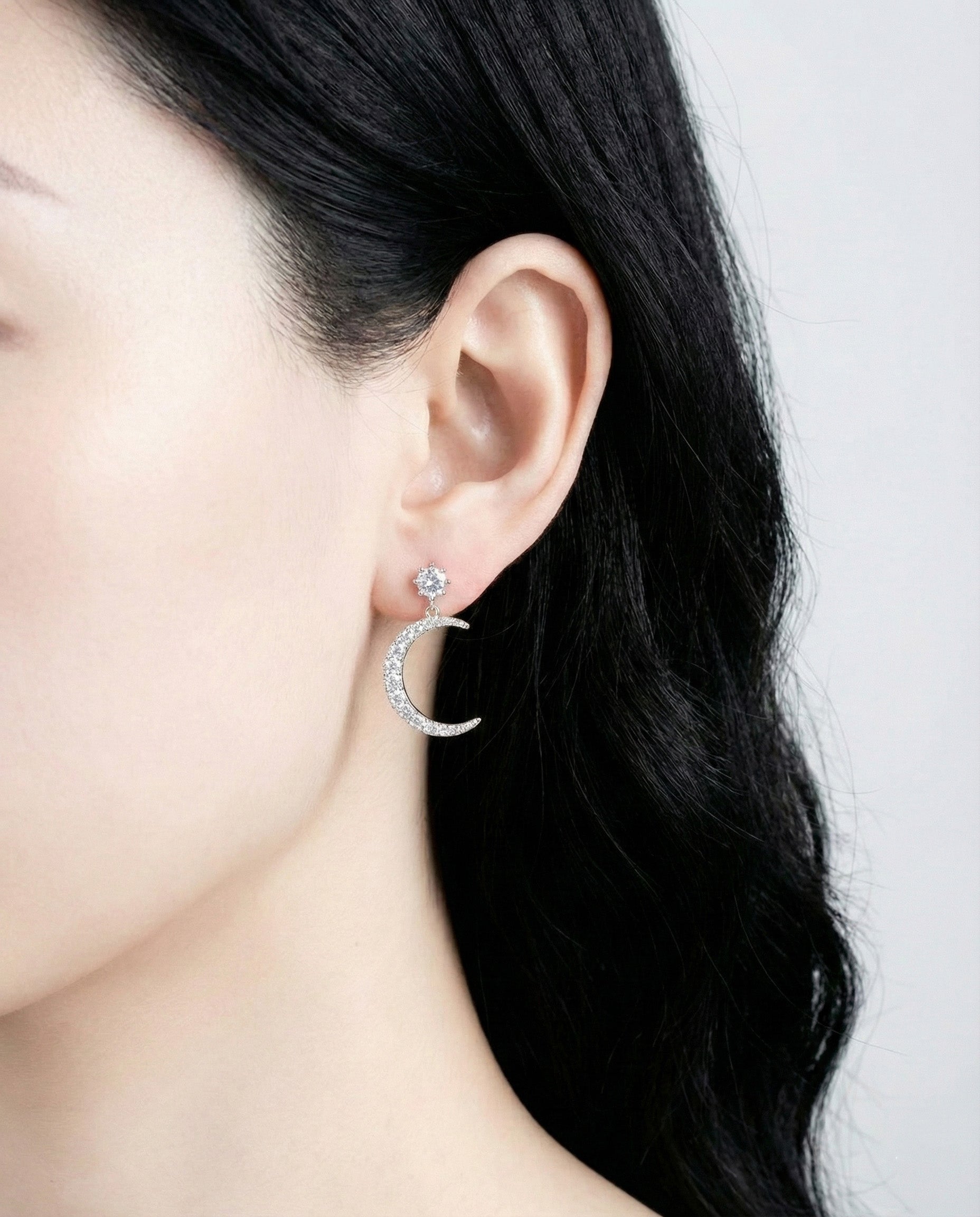 Crescent moon earring with pavé-set crystals side view