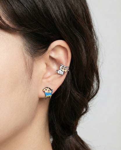 `Woman wearing Shin-chan and Shiro surgical steel stud earrings on ear lobe and inner conch piercing
