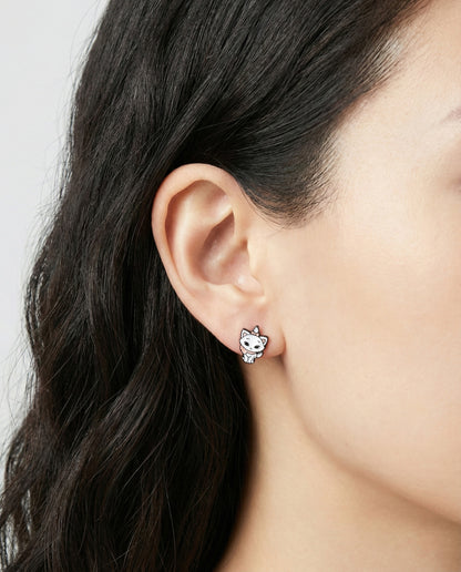 Woman wearing white Marie cat stud earring with pink bow detail