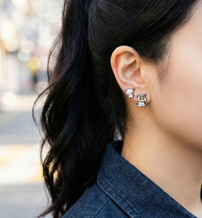 Woman wearing Crayon Shin-chan and Shiro asymmetrical earrings with denim jacket, casual K-fashion style
