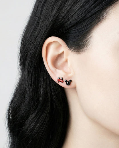 Close-up of ear wearing Mickey Mouse pants and Mickey head stud earrings showing enamel detail and 925 silver posts