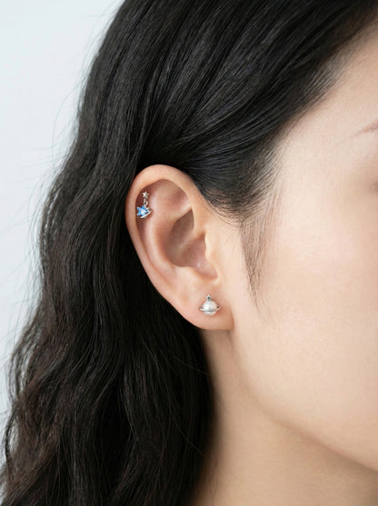 Celestial ear styling with Saturn planet piercing on helix and star stud on lobe in surgical steel"