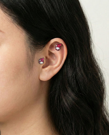  My Melody stud earrings worn on lobe and cartilage piercings for earscape styling