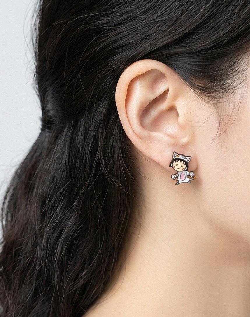 Woman wearing cute Maruko cat costume stud earring close-up on ear