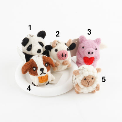 Nepal handcrafted wool felt animal keychains numbered 1 through 5 showing panda cow pig dog and sheep options