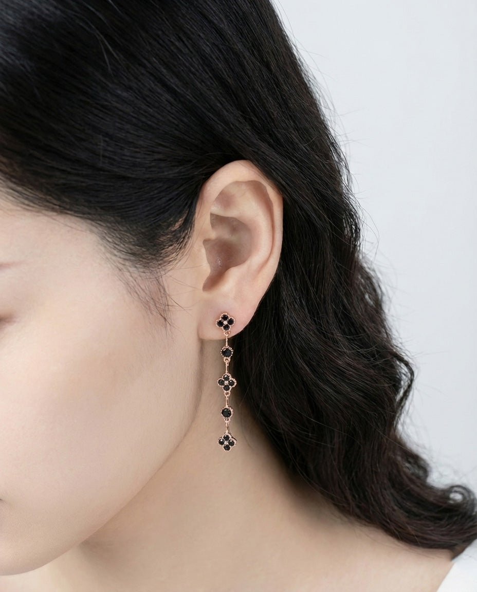 Black onyx clover drop earrings with 925 silver posts modeled on ear