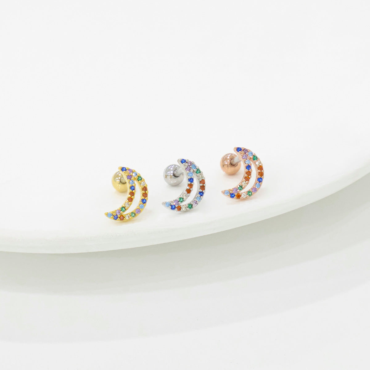 Colorful cubic zirconia moon piercing closeup