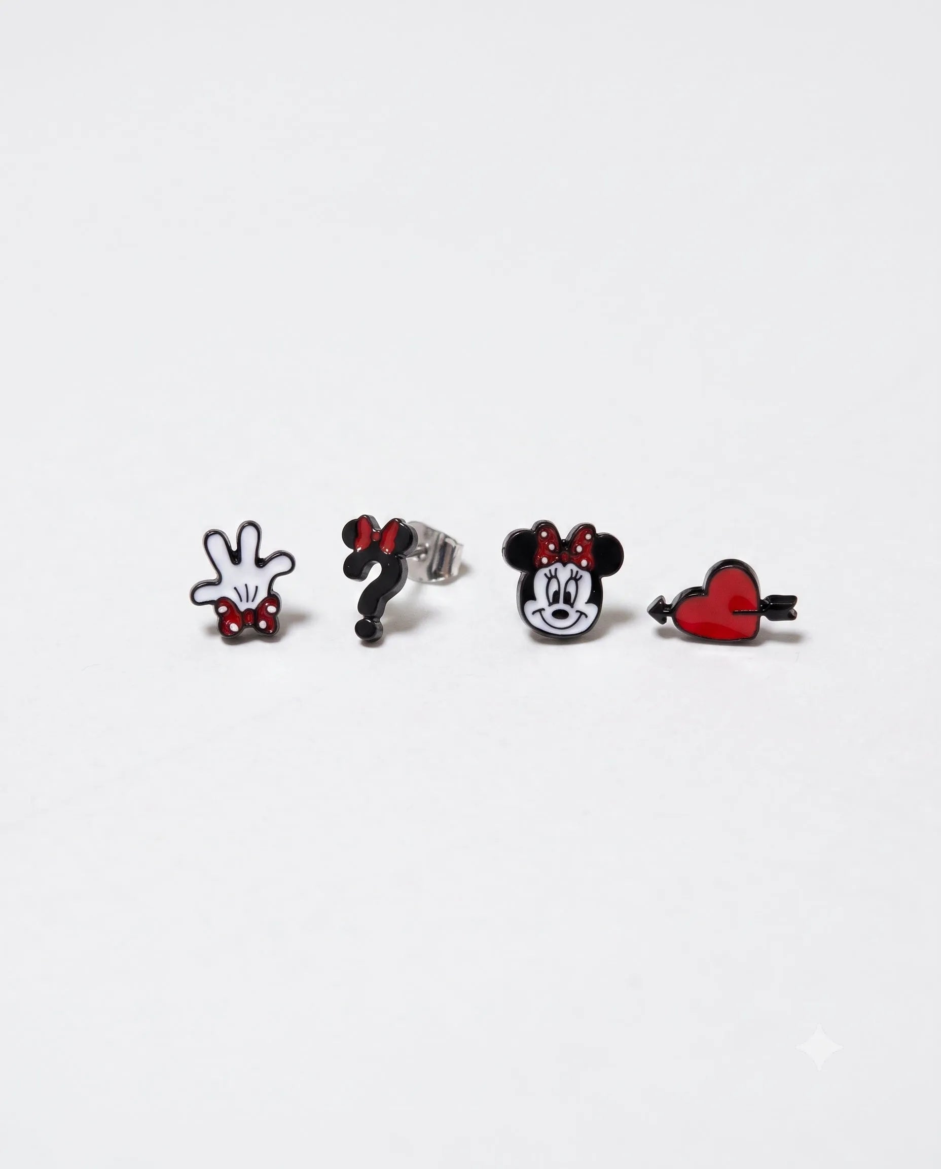 Vintage mouse stud earring set flat lay, brass enamel character studs, mismatched 4-piece set.
