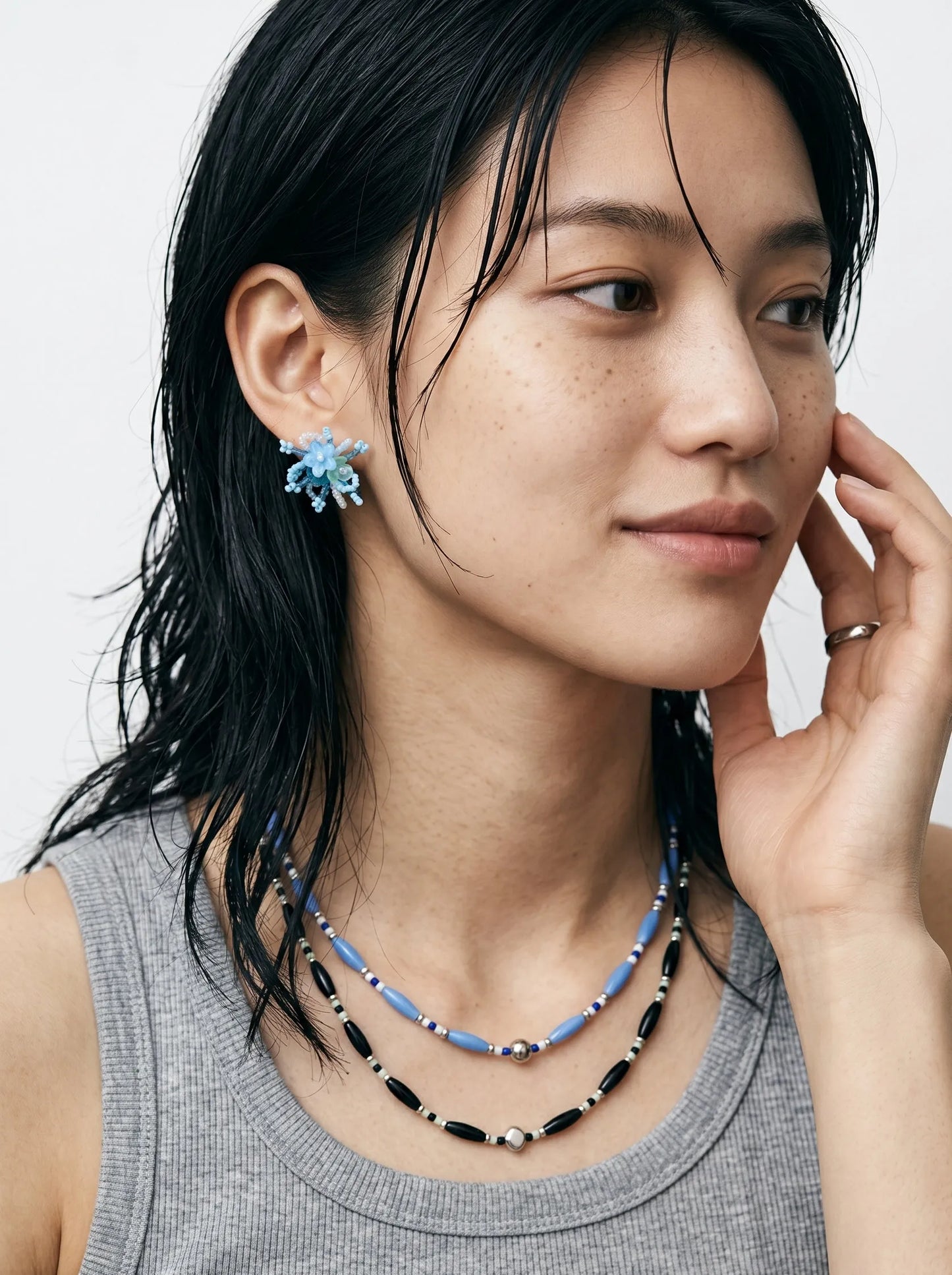 Clean girl aesthetic blue single-strand beaded necklace stacked with black, hypoallergenic.