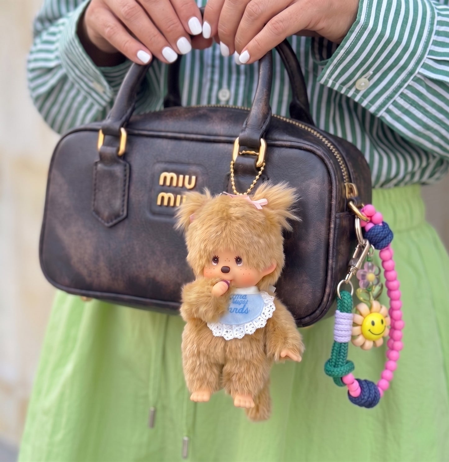 Coquette bag charm inspo — Monchhichi sweet sugar friends basic style on Miu Miu mini bag, K-fashion bag decoration aesthetic with smile bead strap.