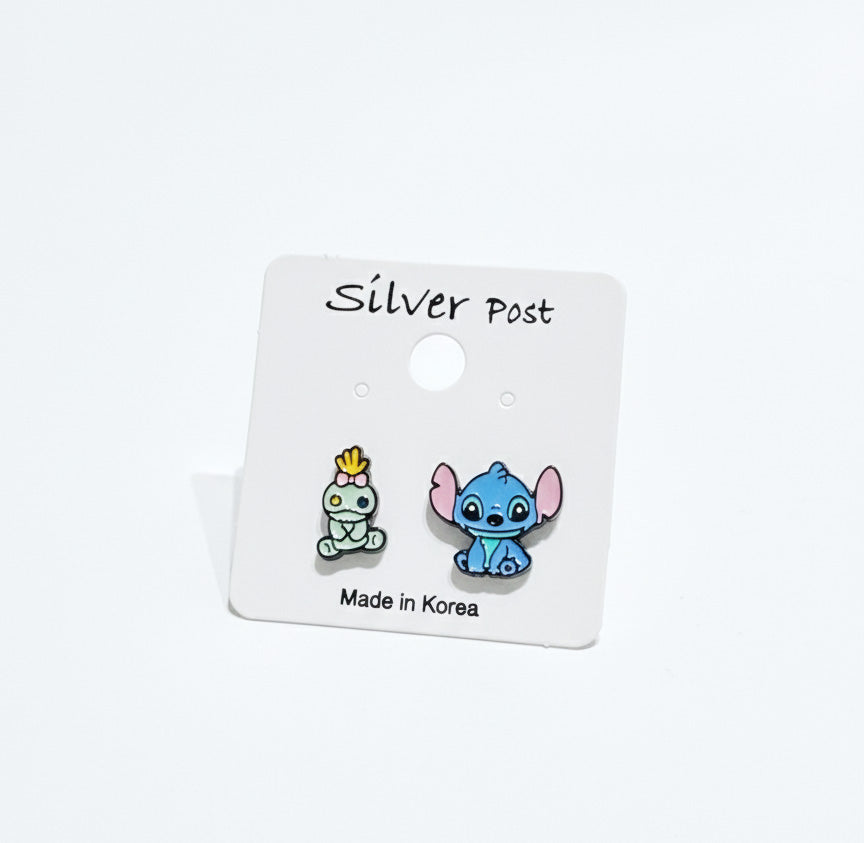 Scrump and sitting Stitch enamel earrings with silver posts, cute character studs on white card.