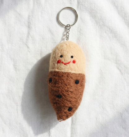 Cute smiling sweet potato felt keychain with brown and beige color