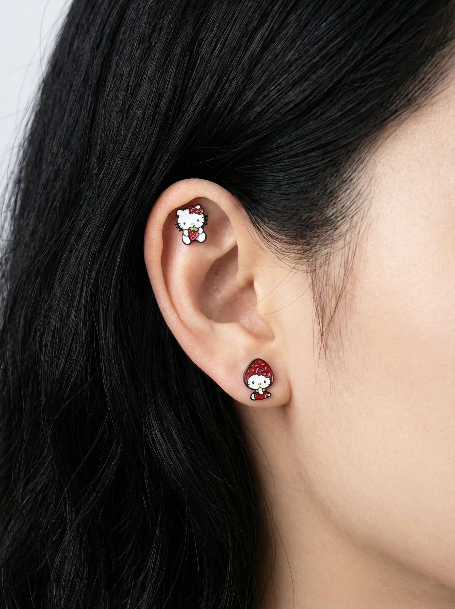 Strawberry Hello Kitty cartilage piercing helix and lobe placement surgical steel
