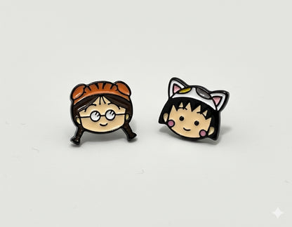 Two character earring studs showing Maruko cat and Tamae tiger face designs