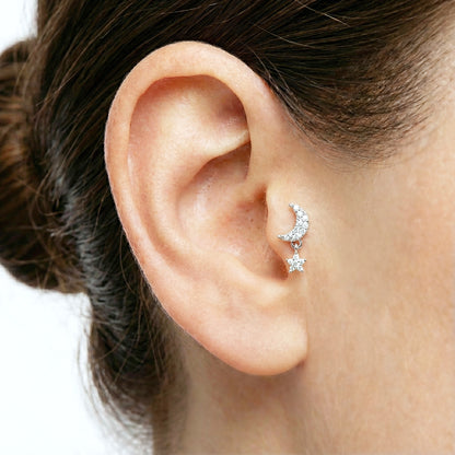 Silver moon & star barbell piercing on tragus