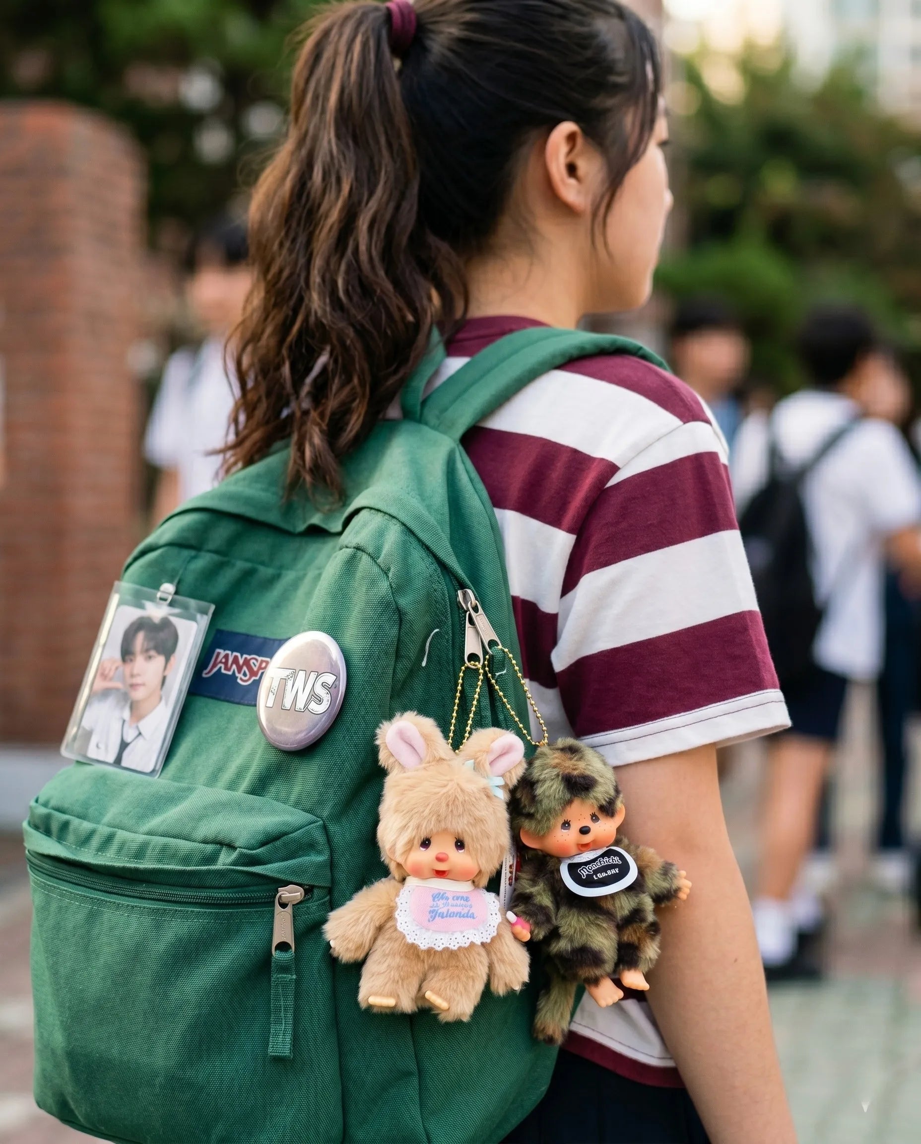 K-fan backpack charm inspo featuring camo plush doll keychain 8ttitto8 layered with character keychain, kidcore bag decoration aesthetic.