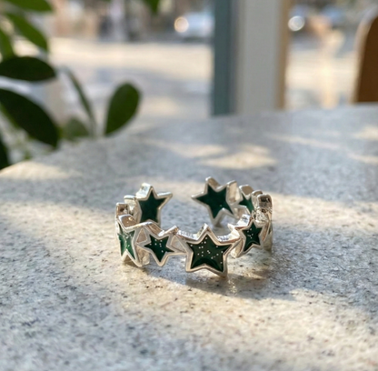 green glitter star open ring showing adjustable design and enamel detail