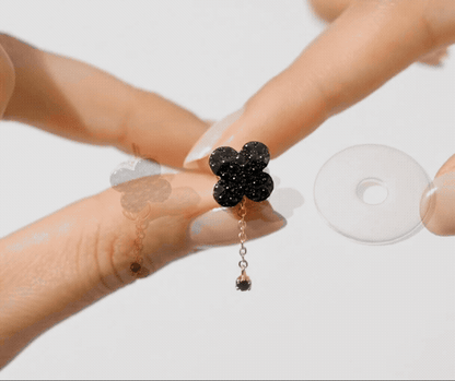 Black clover earrings with dangling chain - 925 sterling silver with black CZ stones, showing sparkle and movement when worn
