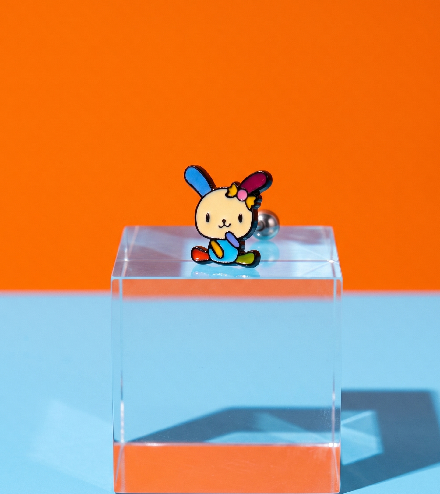 Sanrio Usahana sitting pose enamel barbell stud on acrylic block — vivid rainbow kidcore Y2K jewelry closeup — 8ttitto8