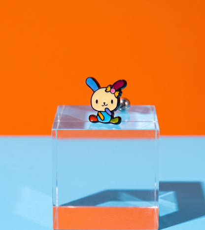 Sanrio Usahana sitting pose enamel barbell stud on acrylic block — vivid rainbow kidcore Y2K jewelry closeup — 8ttitto8