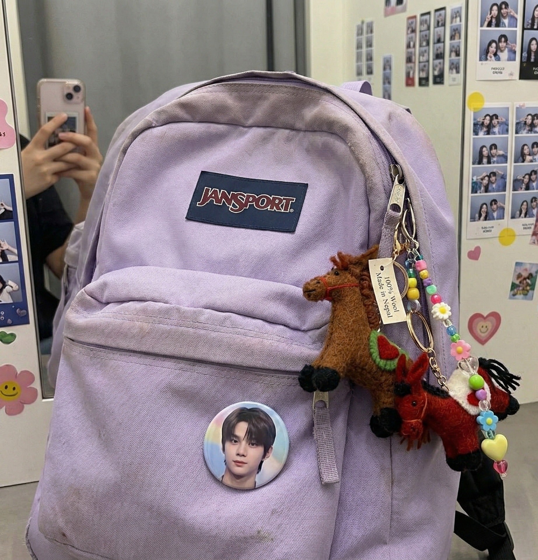 Brown felt horse keychain with colorful beaded charm on lavender Jansport backpack