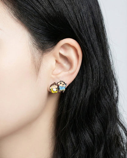 Side view of model wearing asymmetrical Shin-chan and Himawari anime earrings