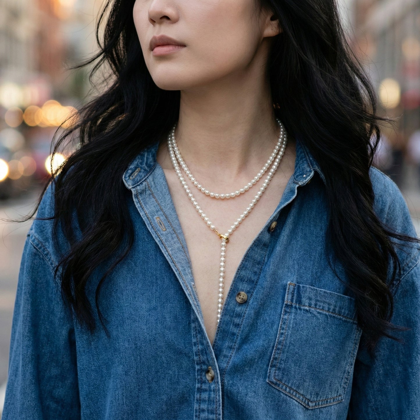 Pearl lariat necklace double-wrap styling with denim shirt - casual chic look"