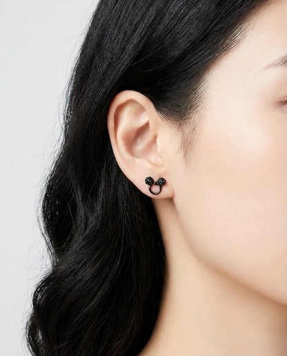 Model wearing Mickey Mouse black crystal stud earring on left ear - side view closeup
