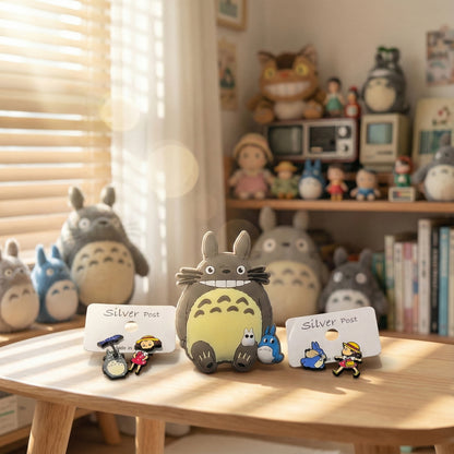 
Handmade Totoro and Mei earrings displayed with Totoro plush toy, authentic Ghibli merchandise